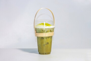 Ice matcha green tea serving on white background, Isolation style.