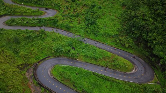 Hairpin bend through lush mountains &mdash; Ha Giang Loop, Vietnam