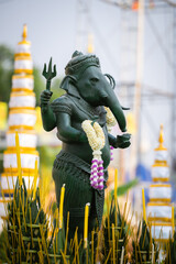 Hindu Lord Ganesha with blurry beautiful and colorful decorative background, Ganesha Ganpati statue, Ganesha festival, Hindu lord concept.