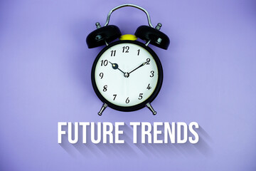 Future Trends text and alarm clock on purple background