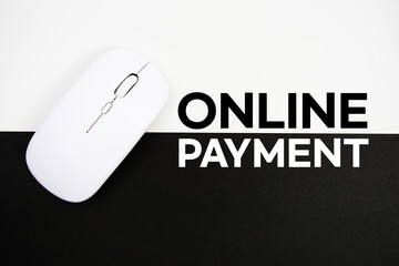 Online Payment text and wireless mouse on white and black background