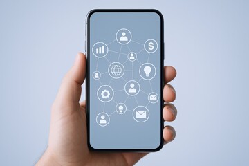 Mobile Technology Concept: Hand Holding Smartphone Displaying Social Network and Business Icons