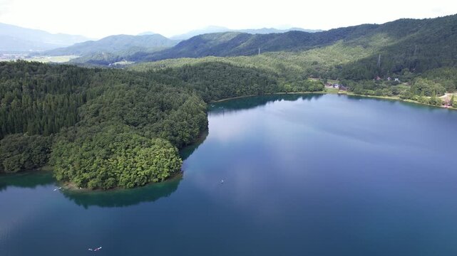 Scenic Forested Mountains At Lake Aoki In Omachi City, Nagano Prefecture, Japan. Aerial Drone Shot
