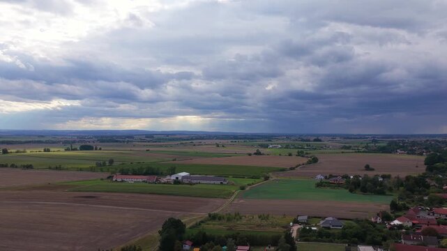 Czech landscape in Moravia, drone view of fields and meadows with small villages between them.