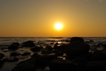 Golden Sunset Over Rocky Shoreline at Inani Beach, Cox's Bazar, Bangladesh