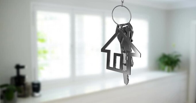 Animation of silver key and house key ring over blurred house interior