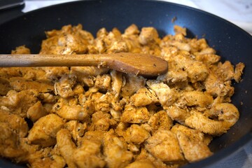 Close-up of traditional Hungarian Brassói chicken stir-fry served in a pan.