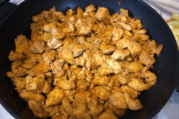 Close-up of traditional Hungarian Brassói chicken stir-fry served in a pan.