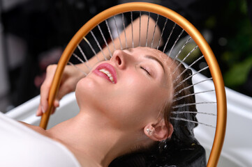 Relaxing head spa with golden water arc