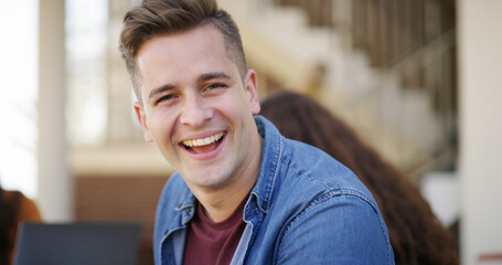 Man, education and portrait of university student laughing for learning, knowledge and scholarship. Smile, college learner and funny person at campus for development, opportunity and future at school