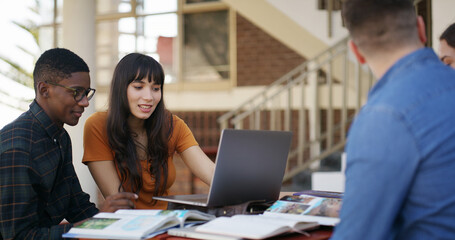 Talking, friends and students with laptop, library or preparing for exam in university or education. Learning, group and planning with tech for knowledge, conversation or research for test in college