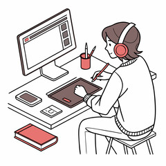 Person working at desk with computer and tablet graphic designer