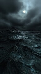 Dark stormy sea at night with a moonlit sky