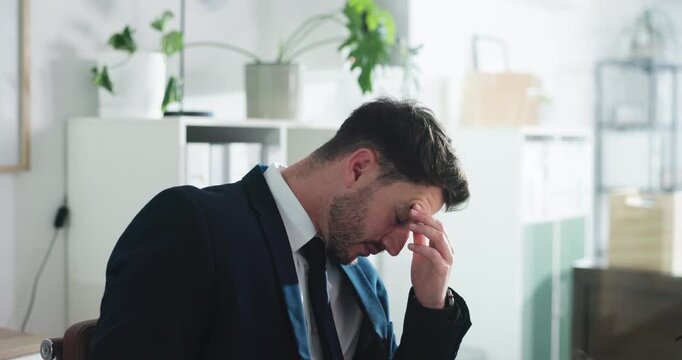 Business, man and serious with thinking in office for court case loss, regret lawsuit or malpractice. Corporate, lawyer and stress at law firm for bad news, negligence and frustrated with suspension