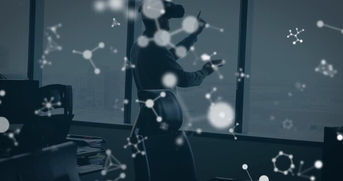 Animation of shapes over caucasian man using vr headset - Powered by Adobe