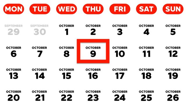 Close-up of the date October 9th marked with a red cursor on the wall calendar 2025