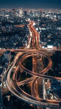 Aerial Night Cityscape View Of Illuminated Highways And Urban Structures