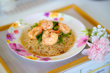 Stir-fried glass noodles with shrimp — a flavorful Thai dish made with soft, translucent noodles stir-fried with shrimp, vegetables, and savory seasonings.