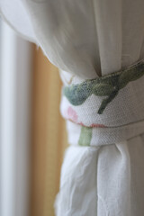 Part of a white linen curtain