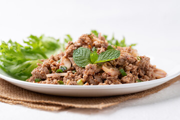 Local Thai food, Spicy minced pork salad (Larb Moo) on white background