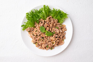 Local Thai food, Spicy minced pork salad (Larb Moo) on white background, Top view