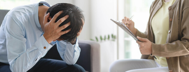 psychologist talking with depressed patient about mental condition.