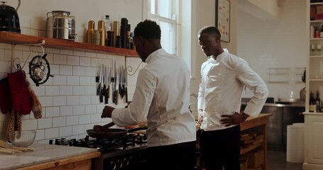 Chef, teaching and men with cooking in kitchen for steak technique, training and sear guidance. Culinary intern, mentor and black people with lesson in restaurant for food preparation and knowledge