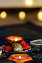 Diwali festival. Decorative sweets and diyas arranged for celebration.