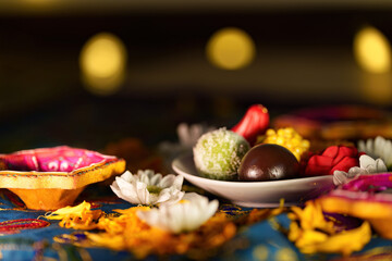 Diwali sweets and decorative lamps creating a festive atmosphere