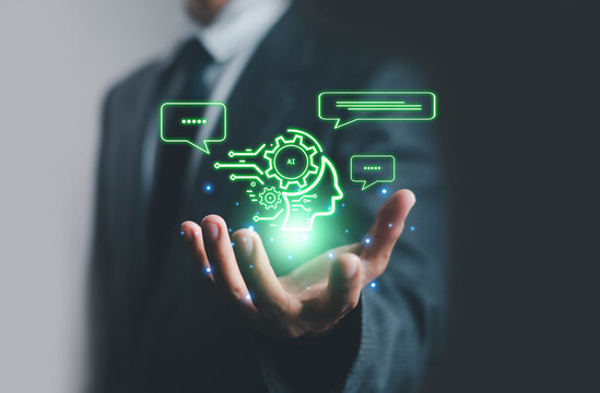 Artificial intelligence concept with digital head and gears hologram above businessman hand, symbolizing AI technology, innovation, machine learning, automation, and data communication.