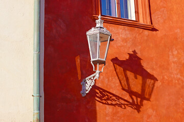 Street lamp on the red building, Cesky Krumlov, Czech Republic