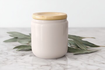 Pale ceramic jar with wooden lid on marble