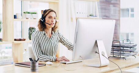 Woman, computer and communication with headset at call center for support or online assistance. Female person, agent or business advisor with service for CRM, advice or virtual help at workplace