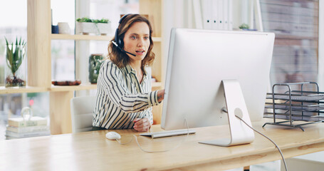 Woman, pointing and computer with headset at call center for communication or online assistance. Female person, agent or business advisor with question for CRM, advice or virtual help at workplace