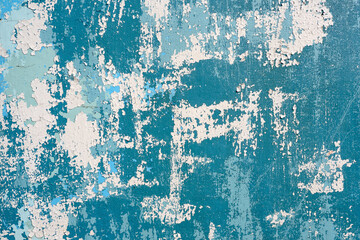 Abstract background, Old cracked blue and white paint on a wooden surface.
