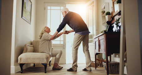 Senior couple, helping hand and door with support for love, trust or commitment together in home. Elderly, man and woman with helpful partner by entrance for old romance or retirement walk in house