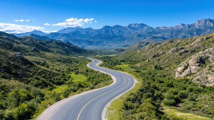 Fototapeta premium Winding road through mountains showcases stunning natural beauty and scenic landscapes