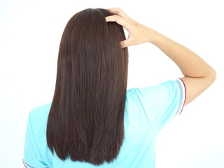 Asian woman scratching on head from itching.