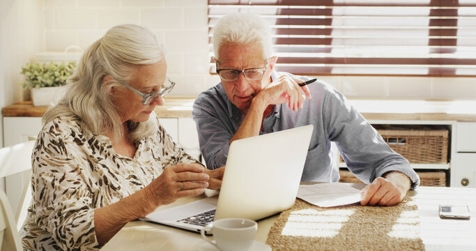 Senior couple, thinking and laptop with documents in retirement home for finance, fund or budget. Elderly, man and woman with paperwork on computer for financial planning or asset management in house - Powered by Adobe