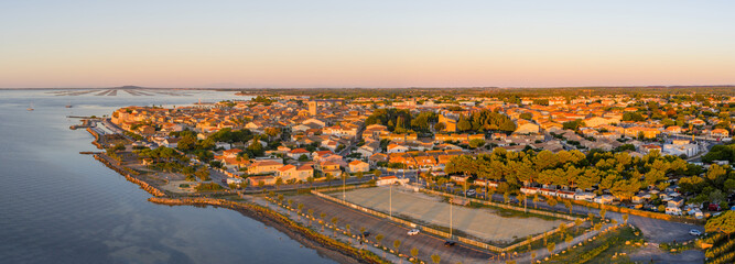 Aerial panorama of Meze at sunrise, in Occitanie, France