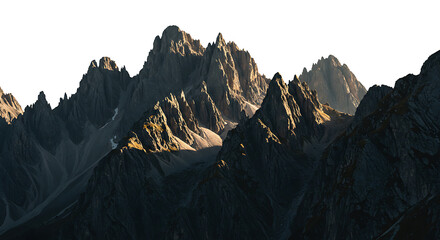 Jagged mountain peaks illuminated by golden sunlight creating dramatic shadows against a bright white background isolated on white background