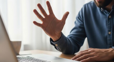 Caucasian male engaging in virtual meeting with laptop at home office