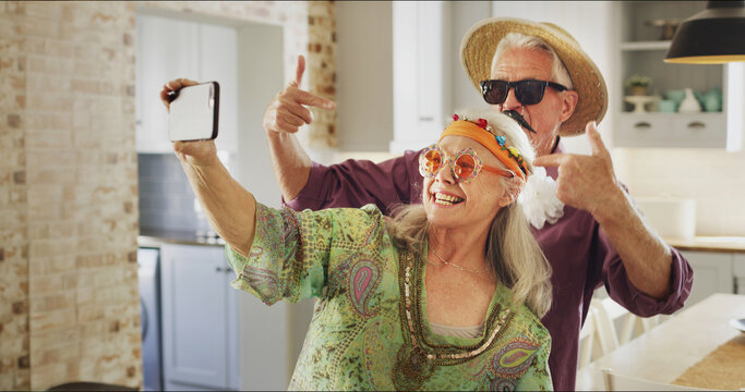 Cool, retro and selfie for senior couple, romance or memory on social media, love or profile picture. Photography, elderly man and vintage with old woman in kitchen, bonding or commitment in marriage