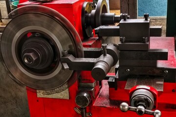 Fototapeta premium Brake disc grinding machine. Grinding the front brake disc.