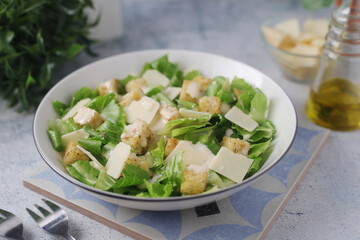 A bowl with classic Caesar salad