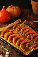 A tray with baked pumpkin in autumn style