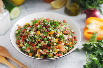 A bowl with traditional Israeli Salad