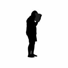 Silhouette of a person covering school books with paper