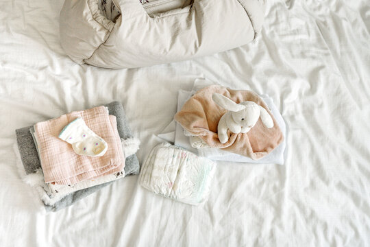 Hospital bag essentials for maternity preparation with baby items