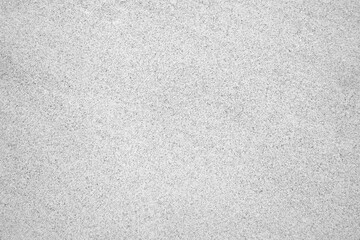 Close-up of fine gray sand on a beach along the Atlantic coast. A subtle natural background.
